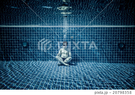 Persons lies under water in a swimming pool 20798358