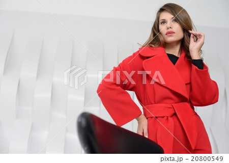 Girl in studio posing at coat 20800549