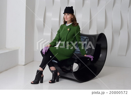 Girl in studio posing at coat Girl in studio posing at coat 20800572