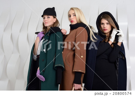 Girls in studio posing at coats 20800574
