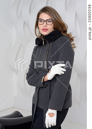 Girl in studio posing at coat 20800598