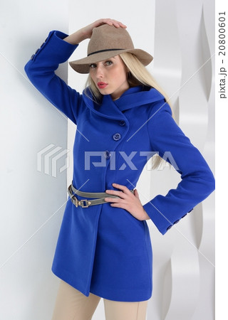 Girl in studio posing at coat Girl in studio posing at coat 20800601