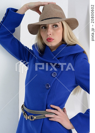 Girl in studio posing at coat Girl in studio posing at coat 20800602