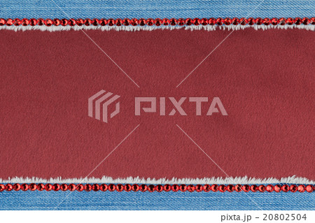 Fashionable background,  jeans and red rhinestones 20802504