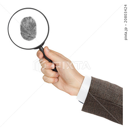 Magnifying glass in hand Magnifying glass in hand 20803424