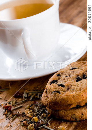 cup of herbal tea and some fresh cookies 20814694