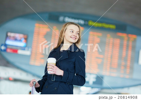 Young woman in international airport Young woman in international airport 20814908