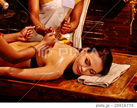 Woman having Ayurvedic spa treatment. 20816778