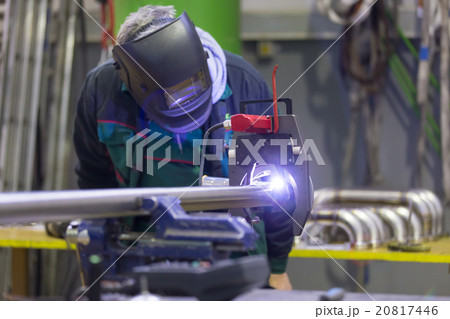 Industrial worker setting orbital welding machine. 20817446