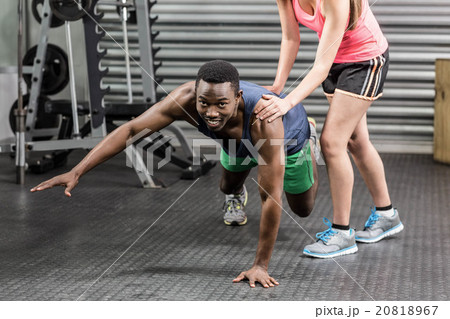 Fit couple doing exercises Fit couple doing exercises 20818967