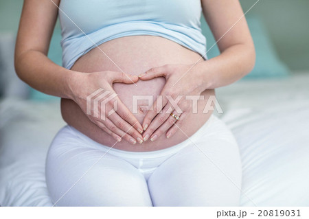 Pregnant woman touching her belly Pregnant woman touching her belly 20819031