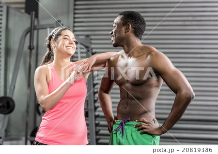 Fit couple with hands on hips 20819386