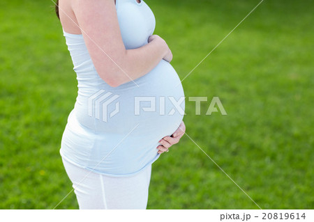Pregnant woman touching her belly 20819614