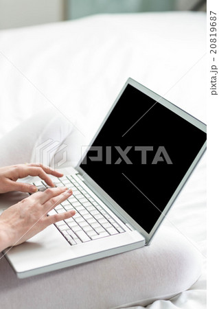 Feminine hands typing on laptop 20819687