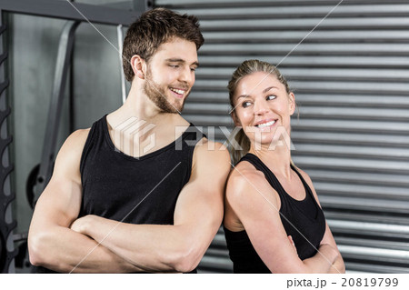 Fit couple with arm crossed 20819799