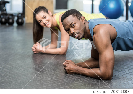 Athletic man and woman working out 20819803