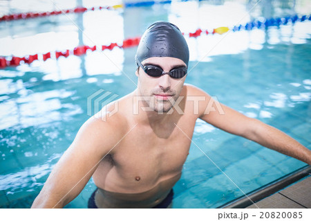 Handsome man wearing swim cap and goggles Handsome man wearing swim cap and goggles 20820085