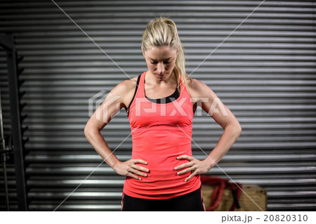 Woman posing with hands on hips Woman posing with hands on hips 20820310