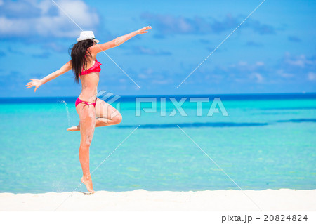 Young beautiful woman having fun during beach 20824824