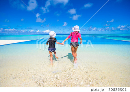 Adorable little girls playing in outdoor swimming Adorable little girls playing in outdoor swimming 20826301