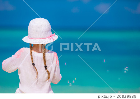 Adorable little girl making soap bubbles during Adorable little girl making soap bubbles during 20829839