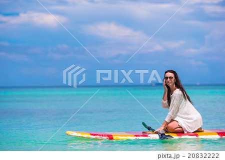 Active young woman on stand up paddle board Active young woman on stand up paddle board 20832222