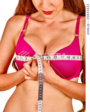 Girl in lingerie measures her breast measuring Girl in lingerie measures her breast measuring 20835633