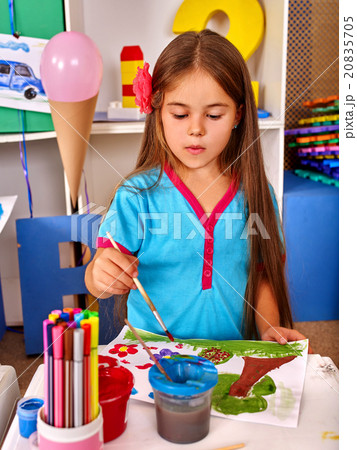 Little girl painting child picture on desk . Little girl painting child picture on desk . 20835705