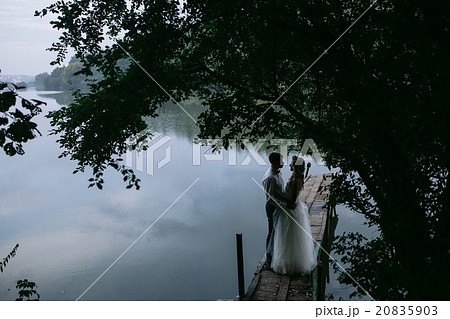 Wedding couple on the old wooden pier 20835903