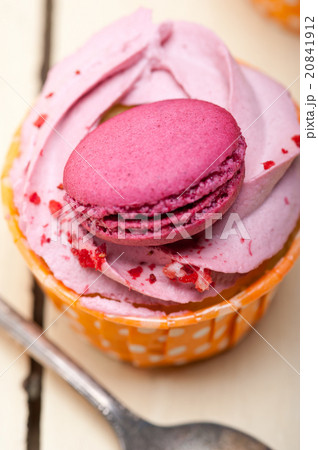 pink berry cream cupcake with macaroon on top pink berry cream cupcake with macaroon on top 20841912