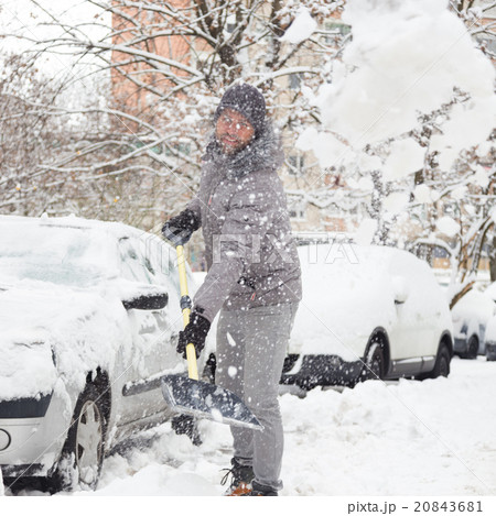 Man shoveling snow in winter. 20843681