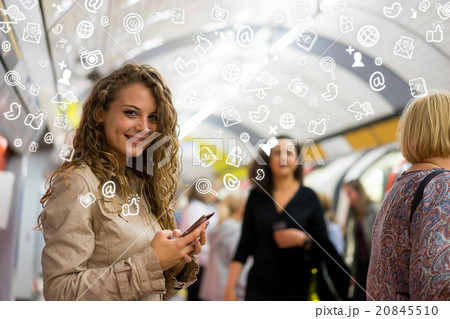 woman using a mobile phone on the tube woman using a mobile phone on the tube 20845510