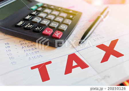 Calculator and pen with words tax. Calculator and pen with words tax. 20850126