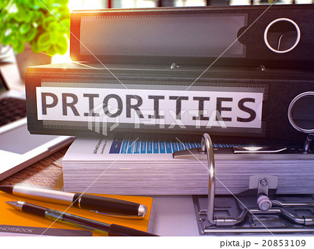 Priorities on Black Office Folder. Toned Image. 20853109