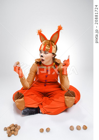 Young woman in the image of red squirrel with Young woman in the image of red squirrel with 20881724