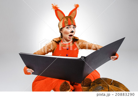 Young woman in the image of red squirrel with big 20883290