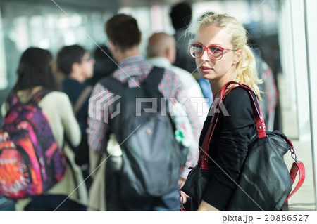Young blond caucsian woman waiting in line. 20886527