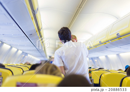 Steward on the airplane. 20886533