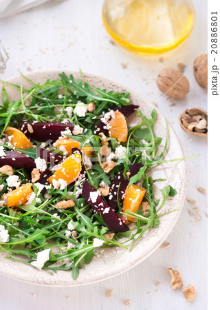 fresh salad with beetroot, arugula and mandarins 20886801