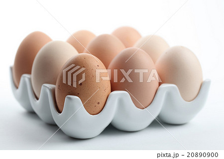 Ceramic egg holder with brown chicken eggs Ceramic egg holder with brown chicken eggs 20890900