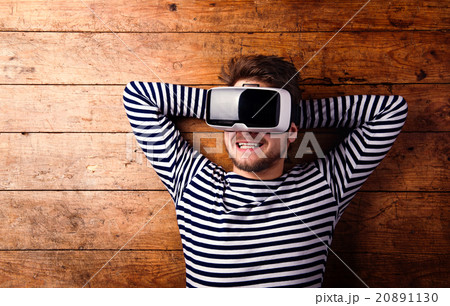 Man wearing virtual reality goggles. Studio shot 20891130