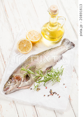 Fresh trout on white wood 20891613