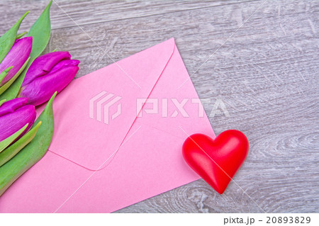 Pink envelope with red heart and purple tulips 20893829