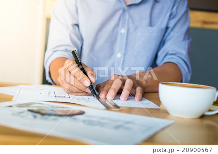 Creative architect projecting on the big drawings Creative architect projecting on the big drawings 20900567