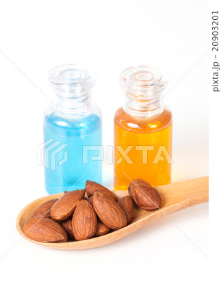 Almonds on wood and oil bottle 20903201