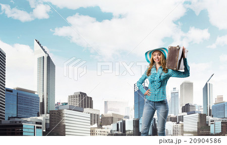 Attractive girl with old suitcase 20904586