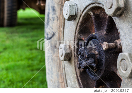 Old wheels on green background 20910257