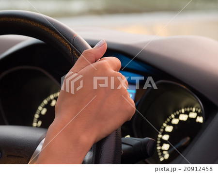 One hand driving car showing meters 20912458