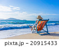Girl on a tropical beach with hat 20915433