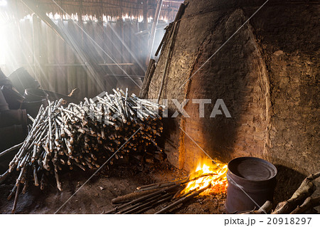 Pile of slow burning wood at charcoal factory 20918297